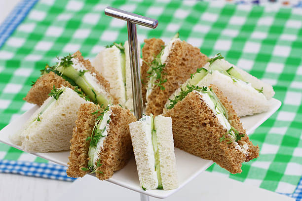 istock Cream cheese and cucumber sandwiches on checkered cloth 489804982