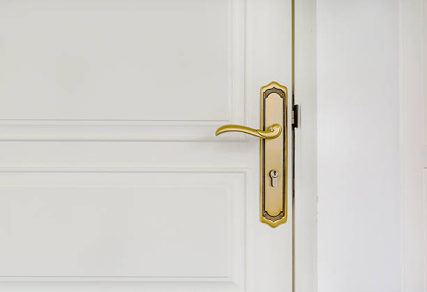 istock classic golden door handle on white door 489805232