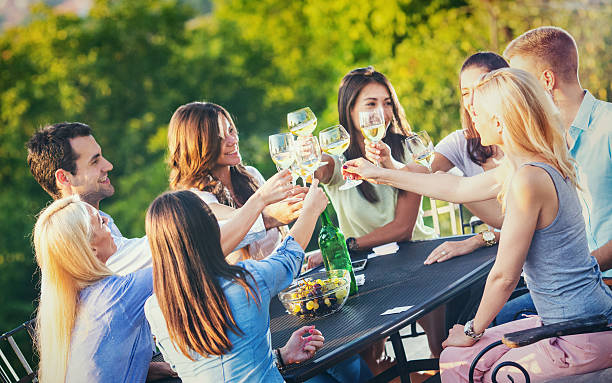 istock Group of people drinking wine outdoors. 489805462