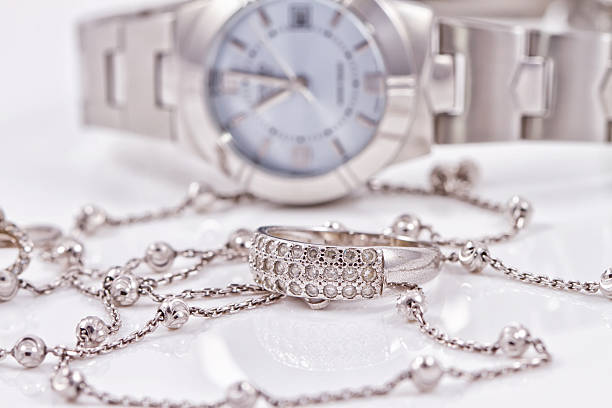 istock Silver ring and chain on the background of watches 489806480