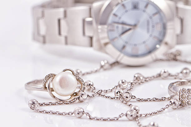 istock Silver ring and chain on the background of watches 489806526