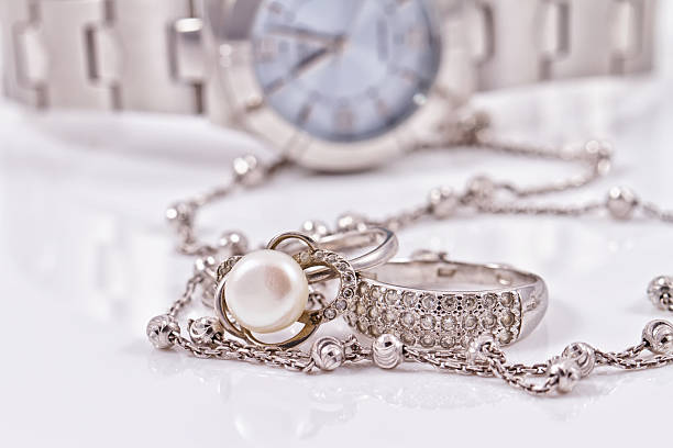 istock Silver ring and chain on the background of watches 489806550
