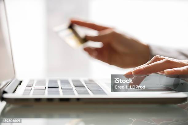 Woman Shopping Using Laptop And Credit Card Indoorcloseup Stock Photo - Download Image Now