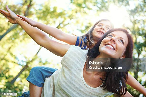 Soaring Through The Trees With Mom Stock Photo - Download Image Now - Family, Lifestyles, Outdoors