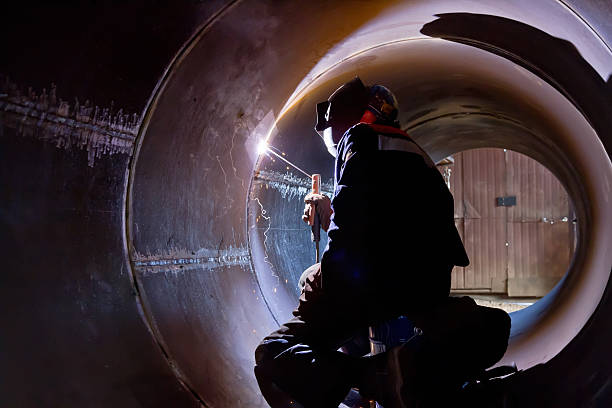 istock welder weld root weld from inside of big pipe 489806632