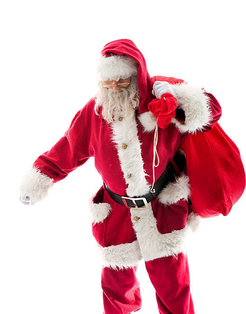 istock St. Nicolas carrying Christmas bag full of presents. 489806640