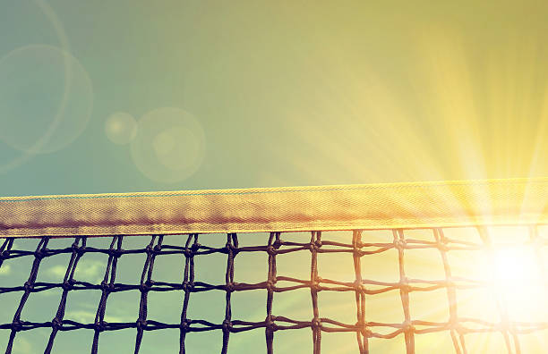 Tennis net with sunset sky