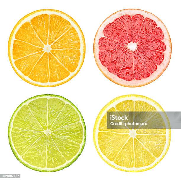 Slices Of Citrus Fruits Isolated On White Stock Photo - Download Image Now - Citrus Fruit, Slice of Food, Lemon - Fruit