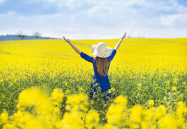 istock Girl in colza field 489807481