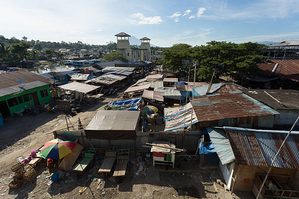 istock Straw poor houses by the river 489807798