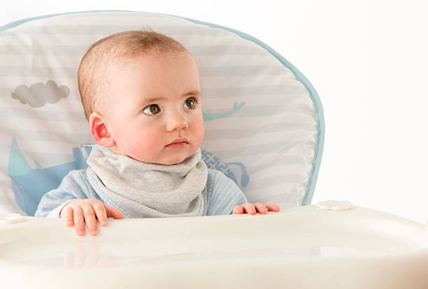 istock Baby in Highchair 489808557