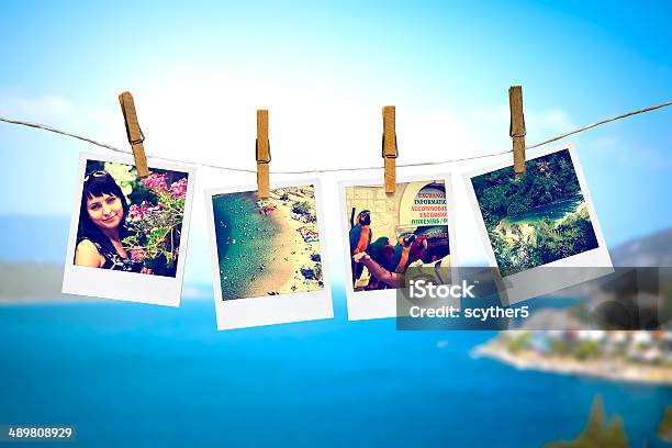Photos Of Holiday Hanging On Clothesline With Sea Stock Photo - Download Image Now - Vacations, Photography, Painting - Art Product