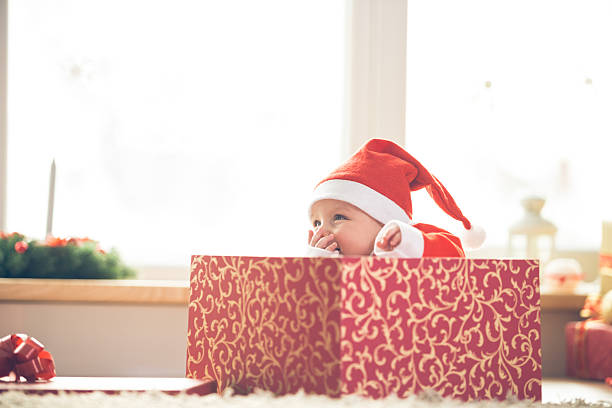 istock Christmas baby in a gift box 489809326
