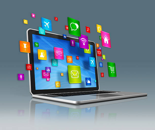 istock Laptop Computer and flying apps icons on a grey background 489809576