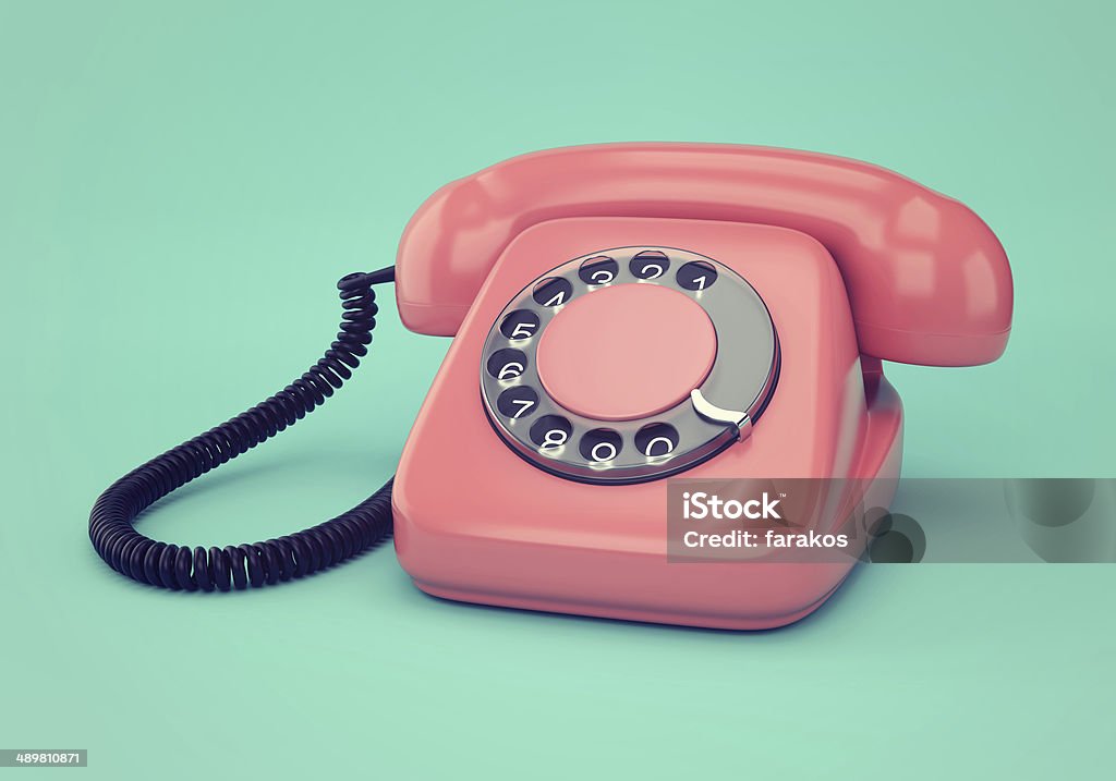 Pink retro telephone Vintage illustration of pink retro rotary dial telephone on blue background Appliance Stock Photo