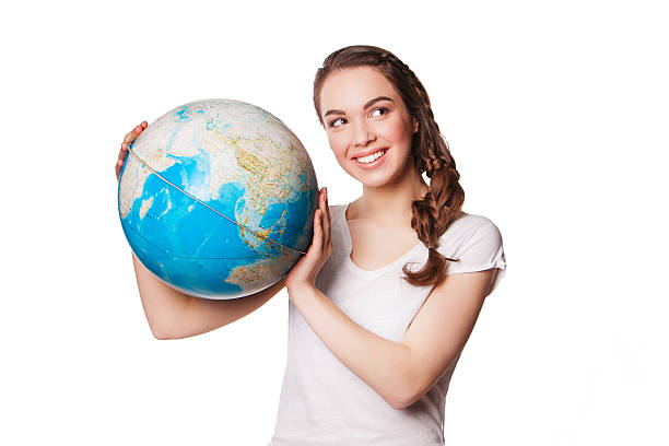 istock pretty smiling young lady holding a world globe. isolated on 489811129
