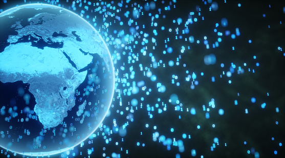 An abstract representation of a digital world. Earth is positioned on the right side with a close up on Europe, Africa and Asia. The entire globe is emitting binary digits in outer space, symbolizing communication, transmissions or broadcast and representing the digital nature of the modern world.