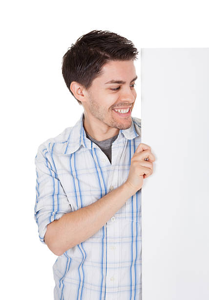 istock Smiling casual man with blank sign 489812006