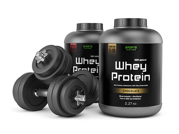 istock Two dumbbells and jars of protein 489812209
