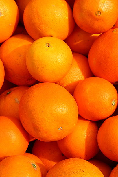 istock Many fresh orange on market 489814043