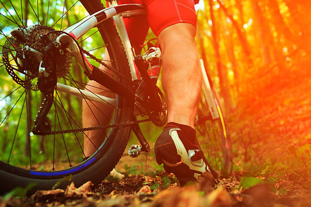 istock low angle view of cyclist riding mountain bike 489830526