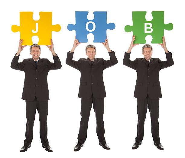 istock Group of business people holding jigsaw puzzle 489830888