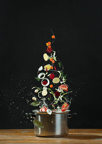 istock Fresh vegetables falling into a stainless steel casserole 489831380