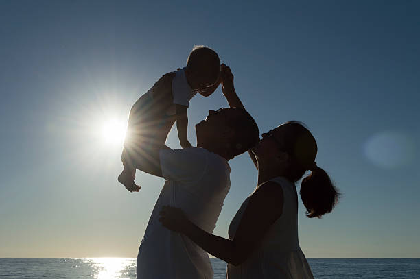 Playful grandparents on the beach