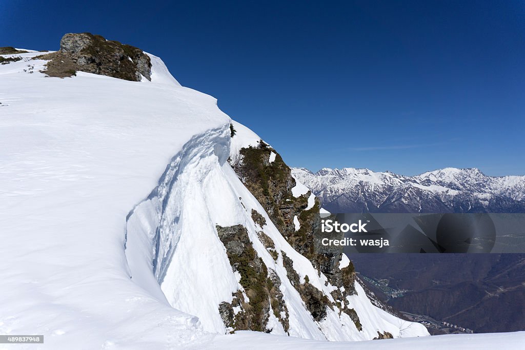 Mountain peak Winter snowy mountain peak and blue sky 2015 Stock Photo