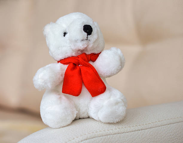 istock Teddy bear is sitting on  sofa in the room 489839244
