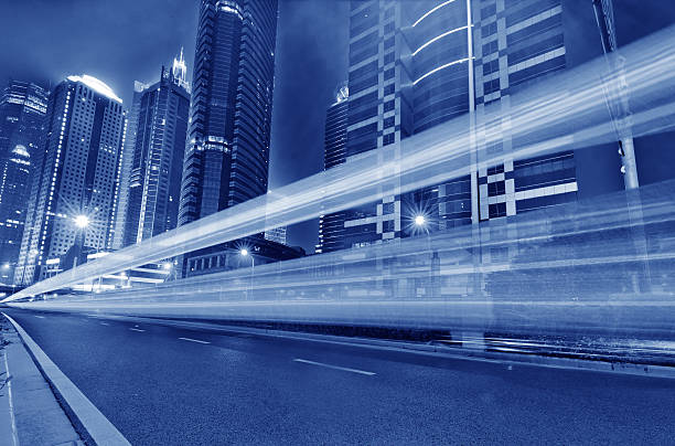 istock light trails on the modern building background in shanghai china 489839646