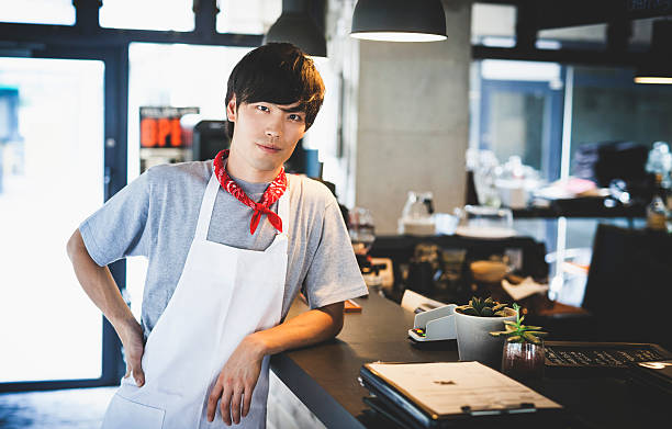istock Young Asian Chef Resting on a Bar Counter 489839684