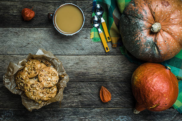 istock Rustic style pumpkins soup and cookies with seeds on wood 489840890