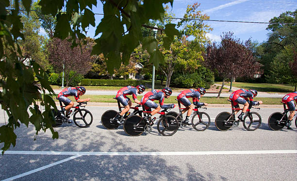 UCI Road World Championships Richmond, Virginia, United States- September 20, 2015: World class riders wearing gray and red  cycle up an incline on Hermitage Road in Richmond, Virginia during time trials at the UCI Road World Championships, Sunday September 20, 2015. uci road world championships stock pictures, royalty-free photos & images