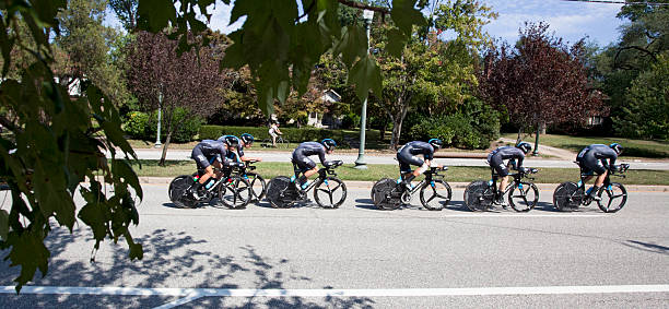 UCI Road World Championships Richmond, Virginia, United States- September 20, 2015: World class riders wearing purple cycle up an incline on Hermitage Road in Richmond, Virginia during time trials at the UCI Road World Championships, Sunday September 20, 2015. uci road world championships stock pictures, royalty-free photos & images