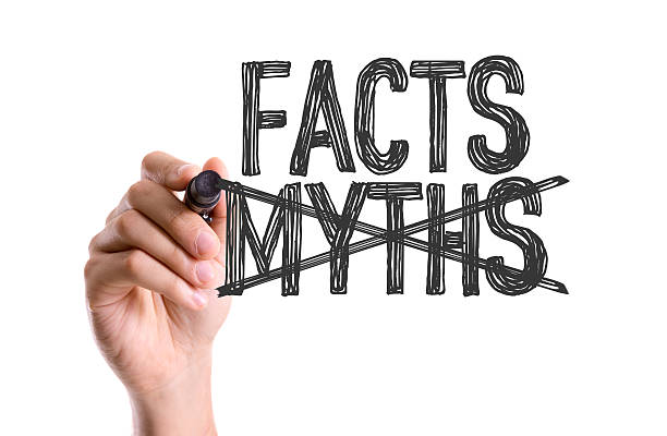 istock Hand with marker writing the word Facts Myths 489843286