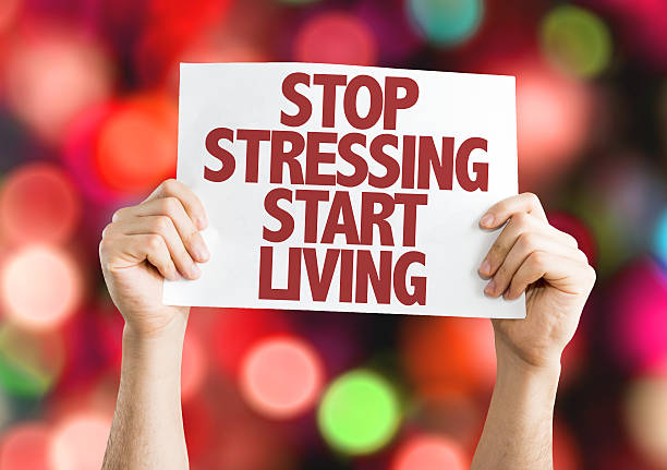 istock Stop Stressing Start Living placard with bokeh background 489843562