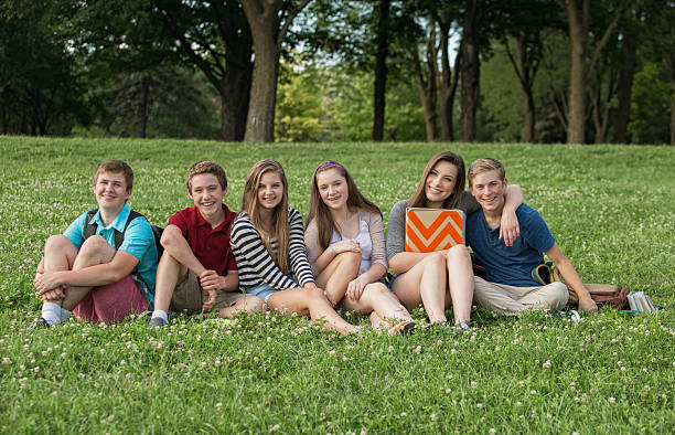 istock Teen Students Sitting Outdoors 489863526