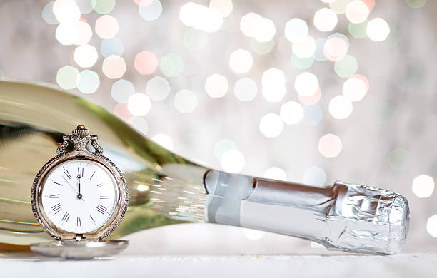 istock New Year's clock and champagne at midnight 489865802