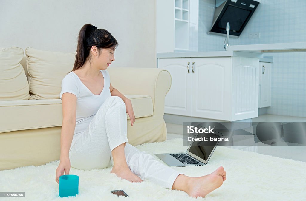 asian woman working at home woman working at home with laptop. 2015 Stock Photo