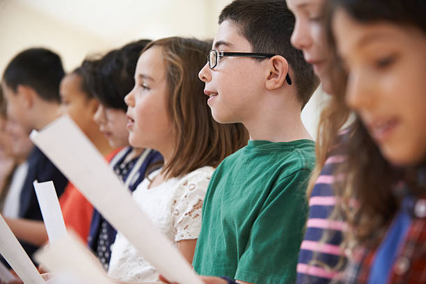 istock Group Of School Children Singing In Choir Together 489866924