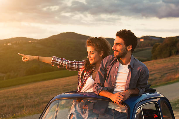 istock Couple watches the sunset from an old machine 489867026