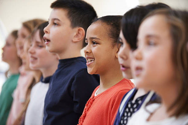 istock Group Of School Children Singing In Choir Together 489867242