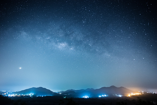 Milky way and full stars in the night. Background of mountain.