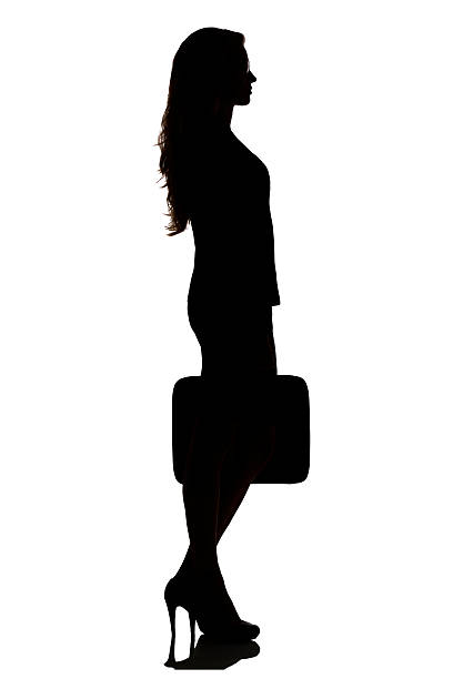 istock silhouette of a busy business woman backlight studio 489870584