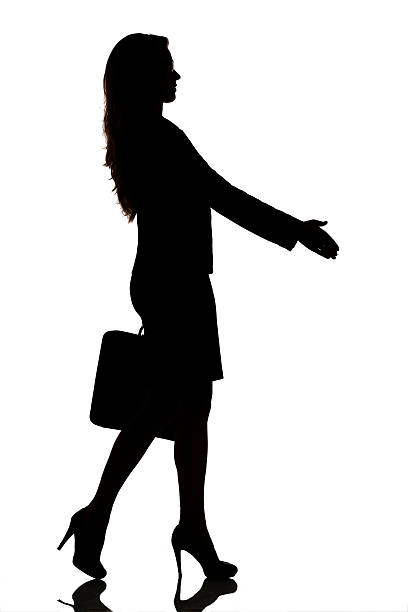 istock silhouette of a busy business woman backlight studio 489870612