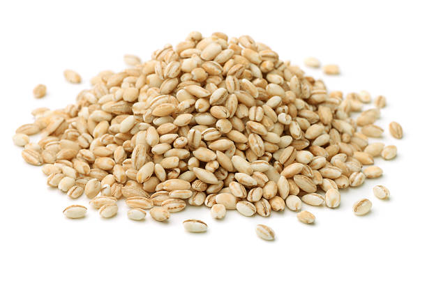 Pearl barley Heap of pearl barley isolated on white barley stock pictures, royalty-free photos & images