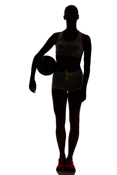 女性はビーチバレープレーヤーシルエットでスタジオ silhouet - isolated volleyball women adult ストックフォトと画像