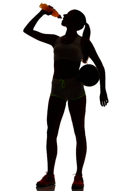 女性はビーチバレープレーヤーシルエットでスタジオ silhouet - isolated volleyball women adult ストックフォトと画像
