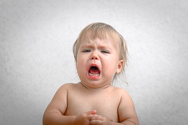 istock roaring crying baby portrait 489872526